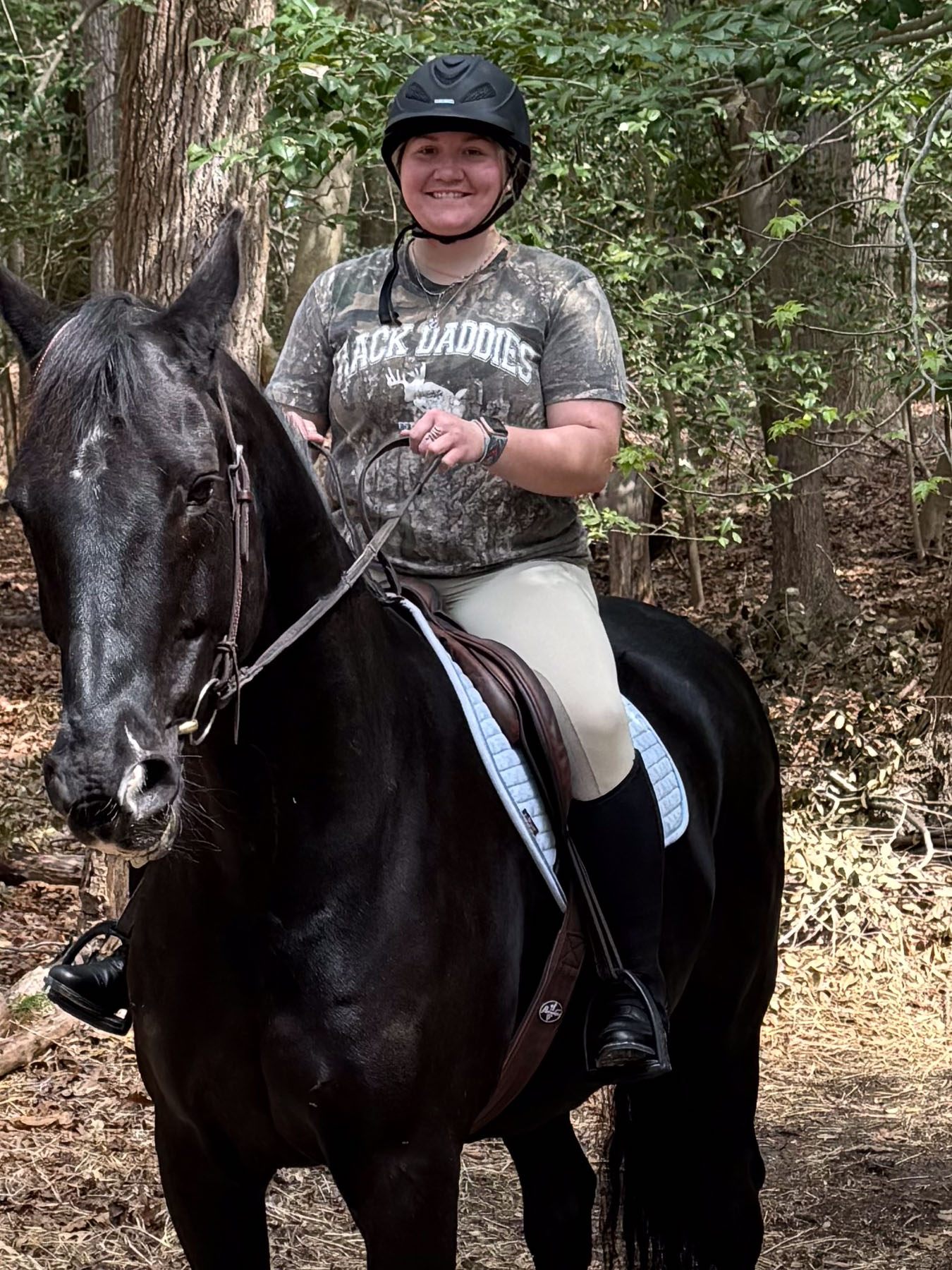 De Lite the horse with rider on back posing