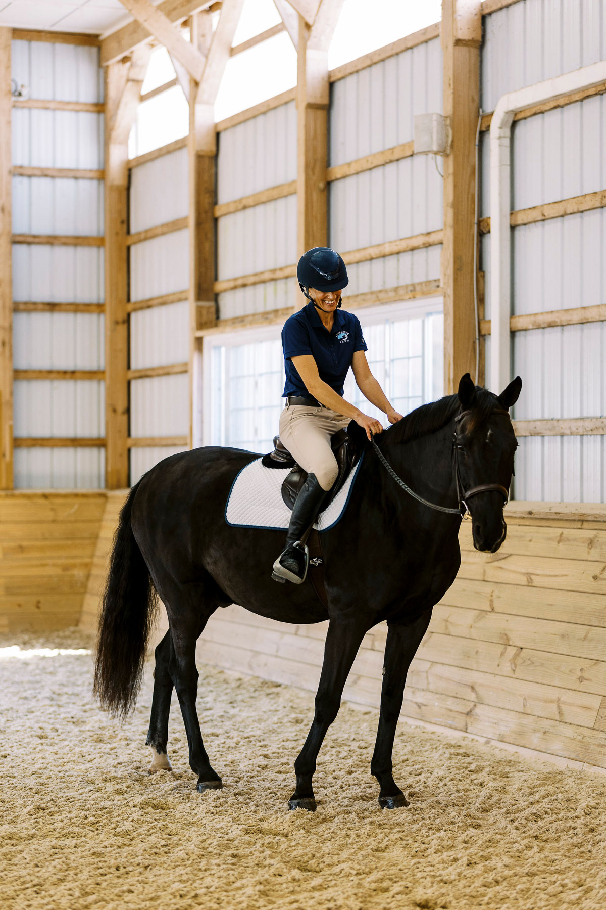 De Lite the horse with rider on back posting